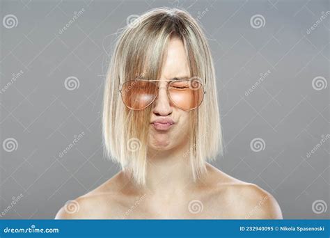 Portrait Of A Short Haired Mature Woman Washing Her Hands With A Soap