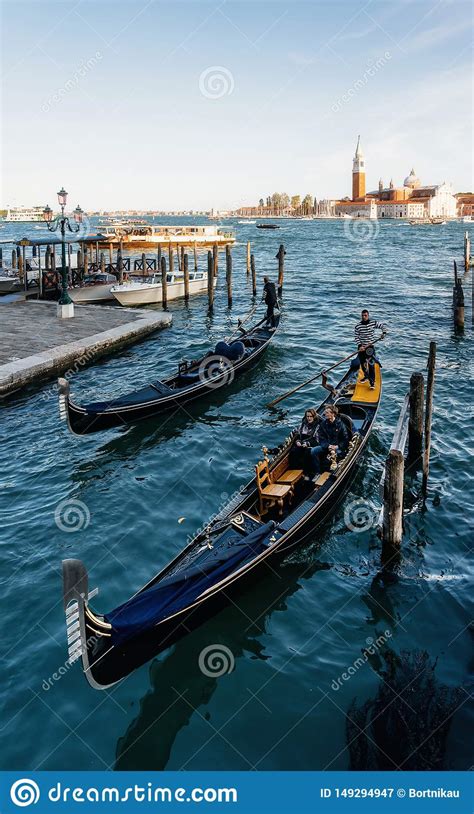 Gondolas Against Boats And San Giorgio Maggiore Island Venice Italy