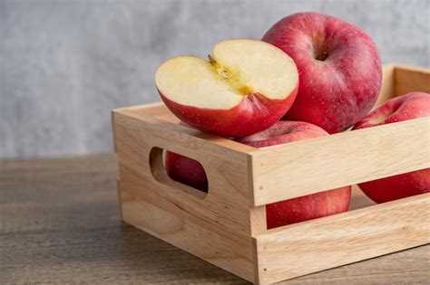 Premium Photo Apple And Half Fruit In Wooden Box With Copy Space