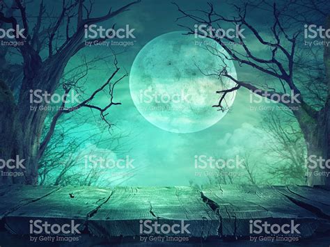 Halloween Background Spooky Forest With Full Moon And Wooden Table