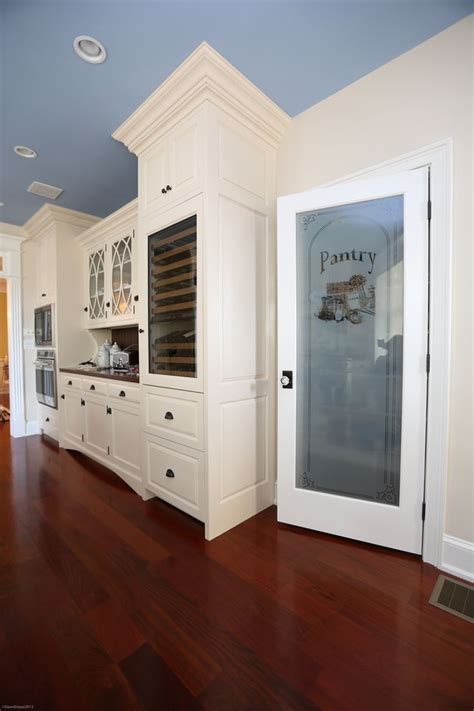 A modern styled kitchen, of course, needs a modern pantry door idea to complement its look. White Painted Cabinetry and Etched Glass Pantry Door ...
