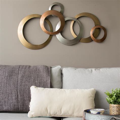 In fact metallic silver wall decor like this not only adds color while making spaces look larger. Stratton Home Decor Multi Metallic Rings Metal Wall Decor ...