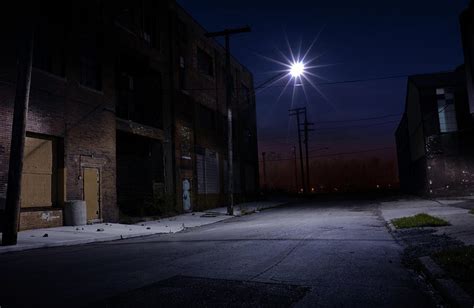 Nighttime View Of An Empty Side Street By Amayfoto
