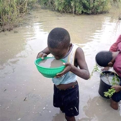 A Poor African Boy Drinking Dirty Water Food Nigeria