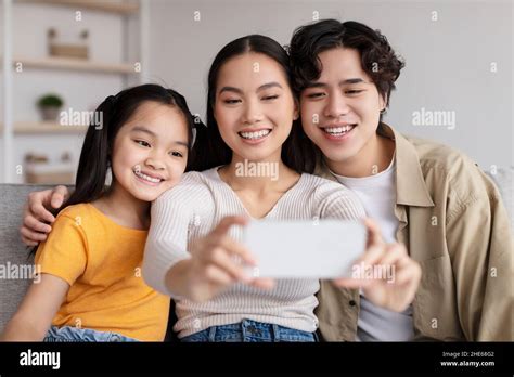 Happy Millennial Attractive Japanese Man Woman And Teenager Girl