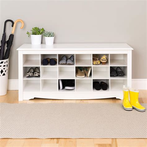 This clever solution is a coat rack, shoe storage and bench all in one piece. Prepac Entryway Shoe Storage Cubbie Bench White WSS-4824