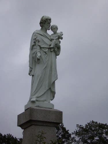 Many sellers believe burying a statue of st. St. Joseph Statue | Sculpture from Notre Dame Cemetery in ...