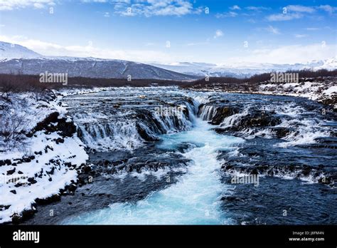 Beautiful Bruarfoss Waterfall With Turquoise Water In Winter South