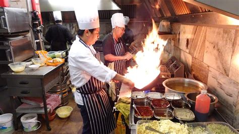 the heat of the indo chinese wok master s kitchen on a very busy saturday night in indian