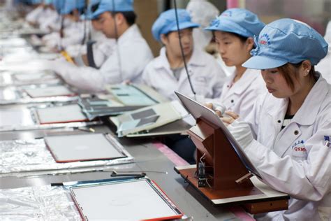 Outside a pegatron factory in shanghai. Foxconn workers put Chinese labor conditions under the ...