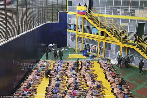 ecuador s war on gangs sees hundreds of soldiers swarm prison and handcuff inmates in their