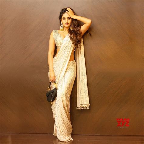 actress nidhhi agerwal latest sexy saree stills social news xyz