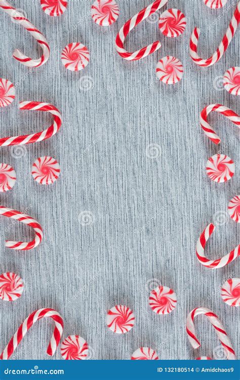 Frame Of Christmas Candy Canes And Peppermint Swirl Candies With Copy