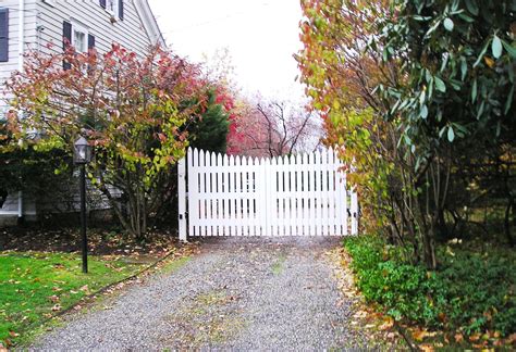 Virtually maintenance free and backed by a lifetime warranty, this classic picket fence will look new for years to come. Automated white wood picket gate | Picket gate, Fence gate ...