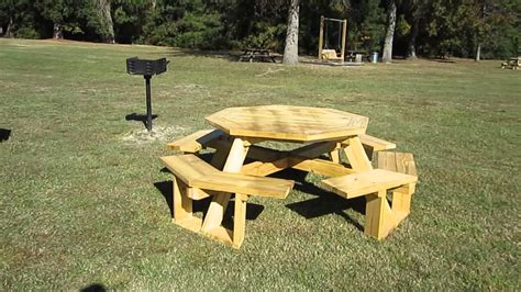 Family barbecue concept with picnic party stuff. New Octagonal Picnic Tables at Cheraw State Park, South ...