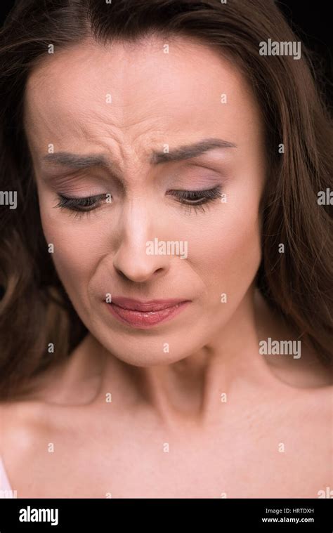 Close Up Portrait Of Beautiful Young Woman Crying And Looking Down