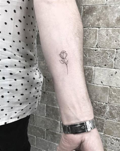 Fine Line Rose Tattoo On The Left Inner Forearm
