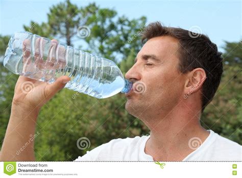 Man Drinking Water From Bottle Royalty Free Stock