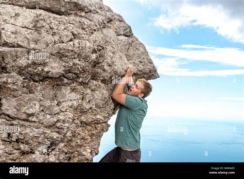 Young Man Hanging Edge Cliff Hi Res Stock Photography And Images Alamy