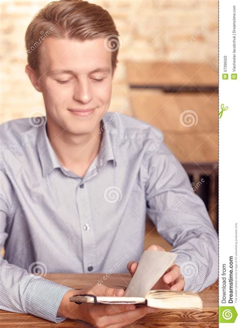 Young Man Reading His Notes In Cafe Stock Image Image Of Poem Book