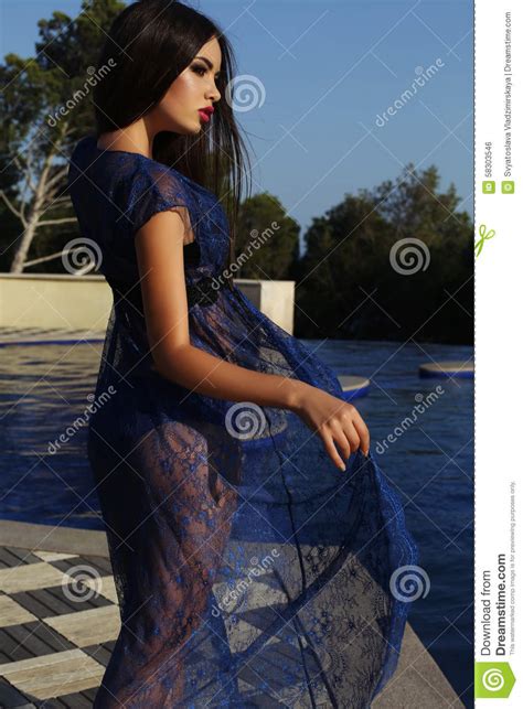 Woman With Dark Hair Wearing Elegant Bikini And Lace Robe