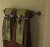 This bathroom benefited from a glass display case nestled between the vanity and wall. Decorative towels in the bathroom | Bathroom towel decor ...