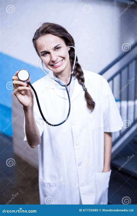 Portrait Of Female Doctor Showing Stethoscope Stock Photo Image Of
