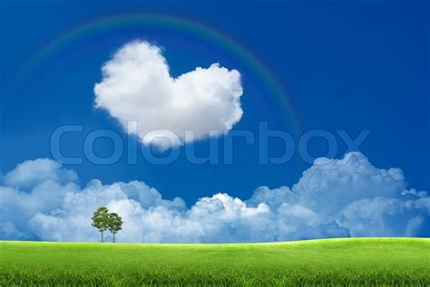 Blue Sky With Clouds And A Rainbow Stock Photo Colourbox