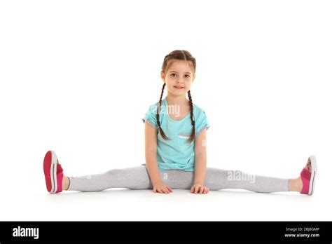 Little Cute Girl Sitting In The Splits Isolated On White Stock Photo