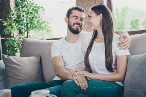 Photo Of Satisfied Pair In Love Communicating Sitting Close To Each