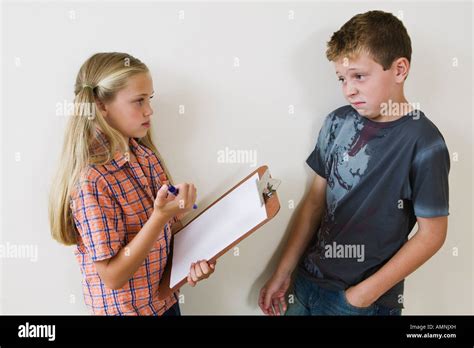 Girl Asking Boy Survey Questions Stock Photo Alamy