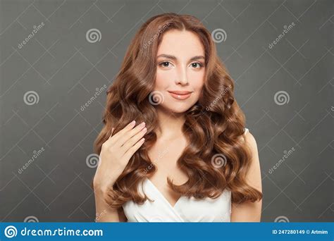 Brunette Model With Long And Shiny Wavy Hair Beautiful Woman With Curly Hairstyle Stock Image