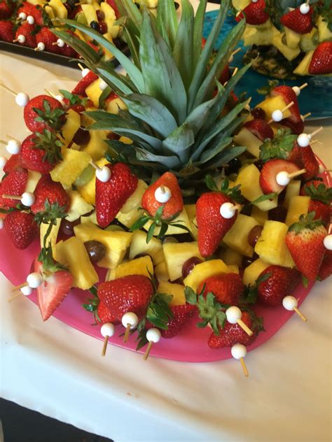Mini Fruit Kabobs With Pineapple Top As Centerpiece Of Platter