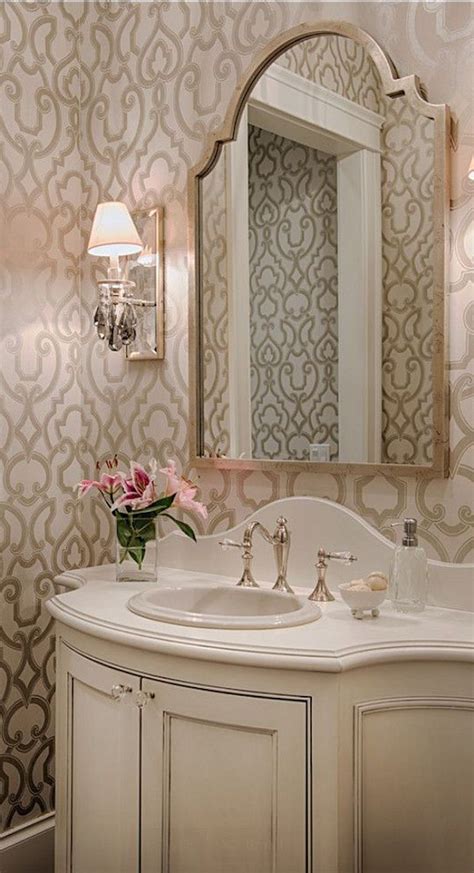 The red and white patterned wallpaper and the style of the vanity also give a traditional decor appearance. Powder Room | Half bathroom decor, Powder room decor ...