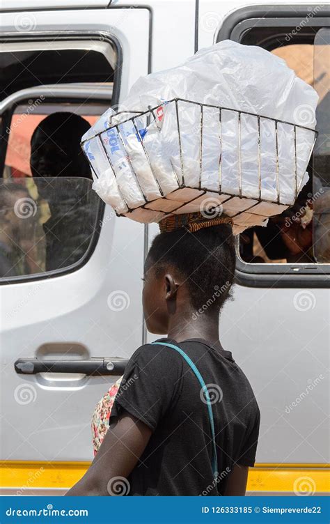 unidentified ghanaian woman carries a basket on her head in loc editorial image image of ghana