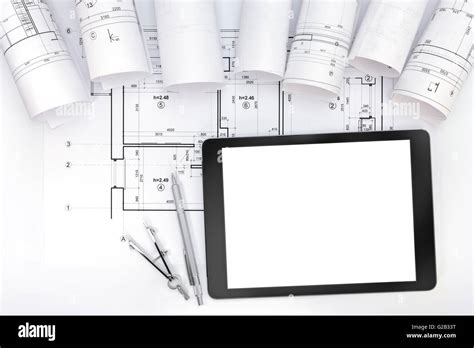 Architects Work Table With Technical Drawings Tablet Computer And