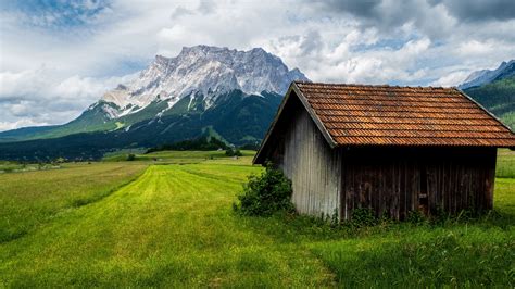 Landscape View Of Mountains Green Trees Grass Field Stone Hut 4k Hd