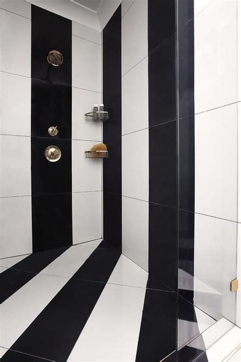 White And Black Striped Vertical Tiles Accent A Seamless Glass Walk In