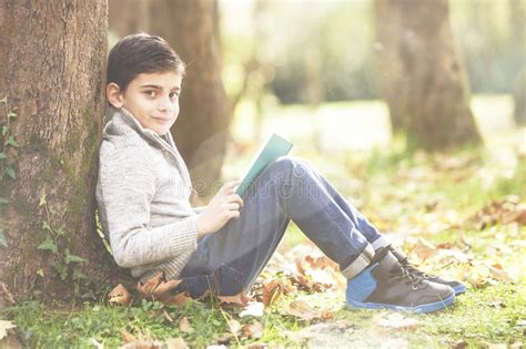 238 Boy Reading Book Under Tree Stock Photos Free And Royalty Free