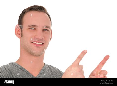 Smiling Young Man Pointing Upwards Stock Photo Alamy
