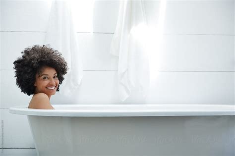 Portrait Of Woman Smiling In Bathtub Taking A Bath By Stocksy Contributor Trinette Reed