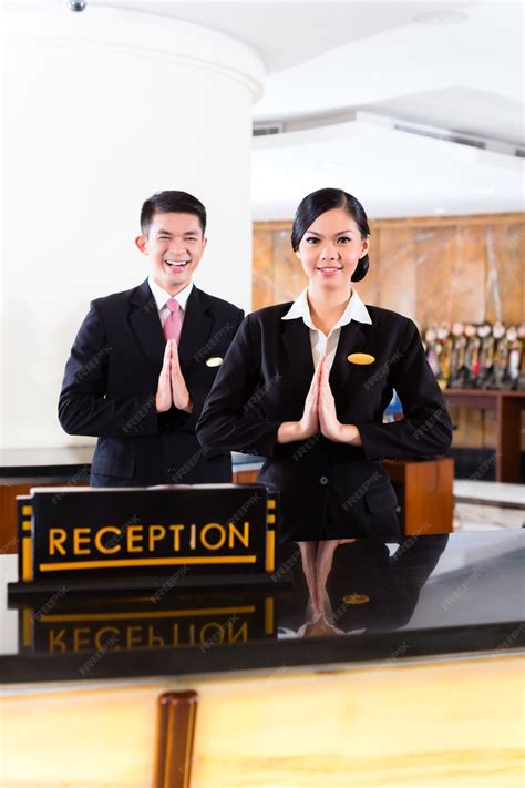 Premium Photo Chinese Asian Reception Team At Luxury Hotel Front Desk