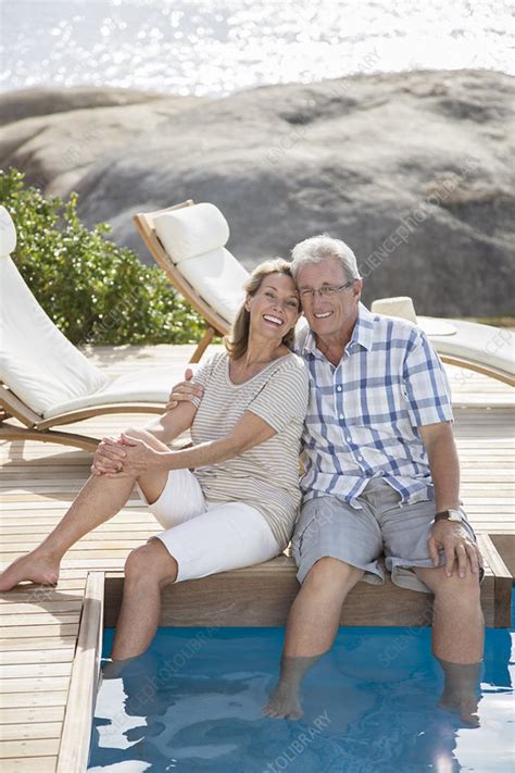Older Couple Relaxing By Swimming Pool Stock Image F0141910 Science Photo Library