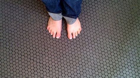 Some charcoal grays appear to be completely neutral but have a hint of brown or green as an undertone. My bathroom floor - charcoal grey penny round tiles with ...