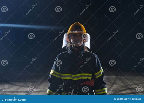 Portrait Of A Female Firefighter Standing And Walking Brave And
