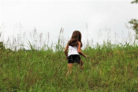 Little Girl Climbing Grassy Hill Free Stock Photo Public