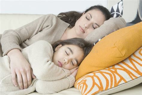 Mother And Daughter Sleeping On Sofa Stock Photo Picture And Royalty