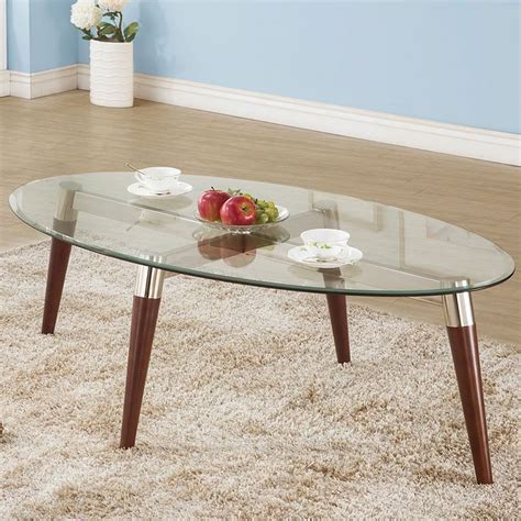 An oval coffee table with a glass top will keep the room feeling light and airy, while those made of thick slabs of marble or concrete will command more attention. Oval Glass Top Coffee Table - Coffee and Cocktail Tables ...