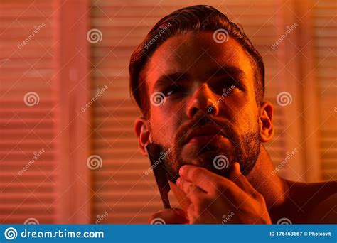 Guy In Bathroom Shaving With Razor With Romantic Light Stock Image Image Of Light Bathroom