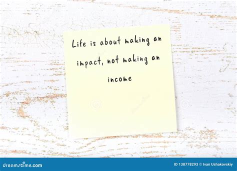 Positive Inspiring Quote Handwritten On Sticky Note On Wooden